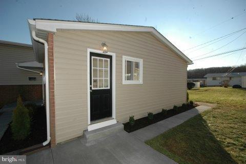 7405 Kathydale Road Pikesville, MD 21208 - Photo 21 of 29 a front view of a house with garden