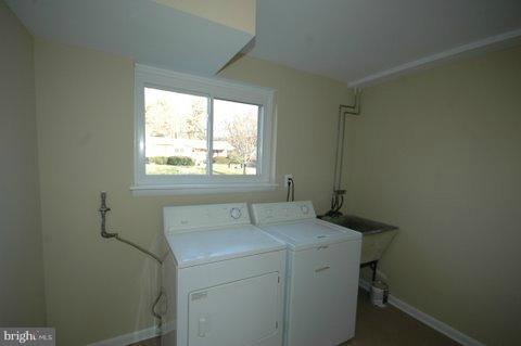 7405 Kathydale Road Pikesville, MD 21208 - Photo 24 of 29 a utility room with dryer and washer