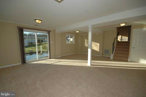 7405 Kathydale Road Pikesville, MD 21208 - Photo 25 of 29 a view of an empty room with a window
