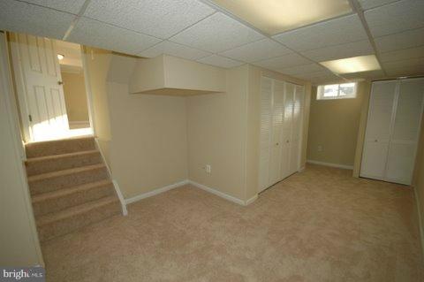 7405 Kathydale Road Pikesville, MD 21208 - Photo 27 of 29 a view of an empty room with a fireplace