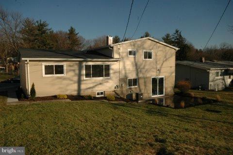 7405 Kathydale Road Pikesville, MD 21208 - Photo 28 of 29 a view of a house with backyard