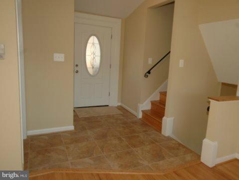 7405 Kathydale Road Pikesville, MD 21208 - Photo 5 of 29 a view of an entryway with wooden floor