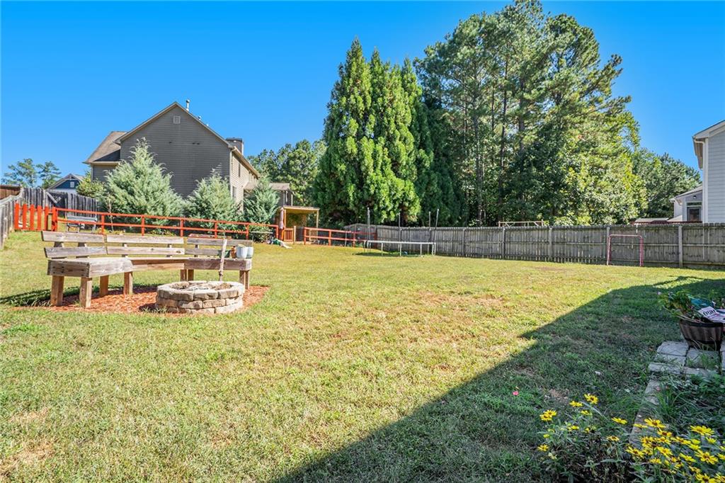 115 Floating Leaf Way Dallas, GA 30132 - Photo 46 of 47 a view of a swimming pool with an outdoor seating and yard