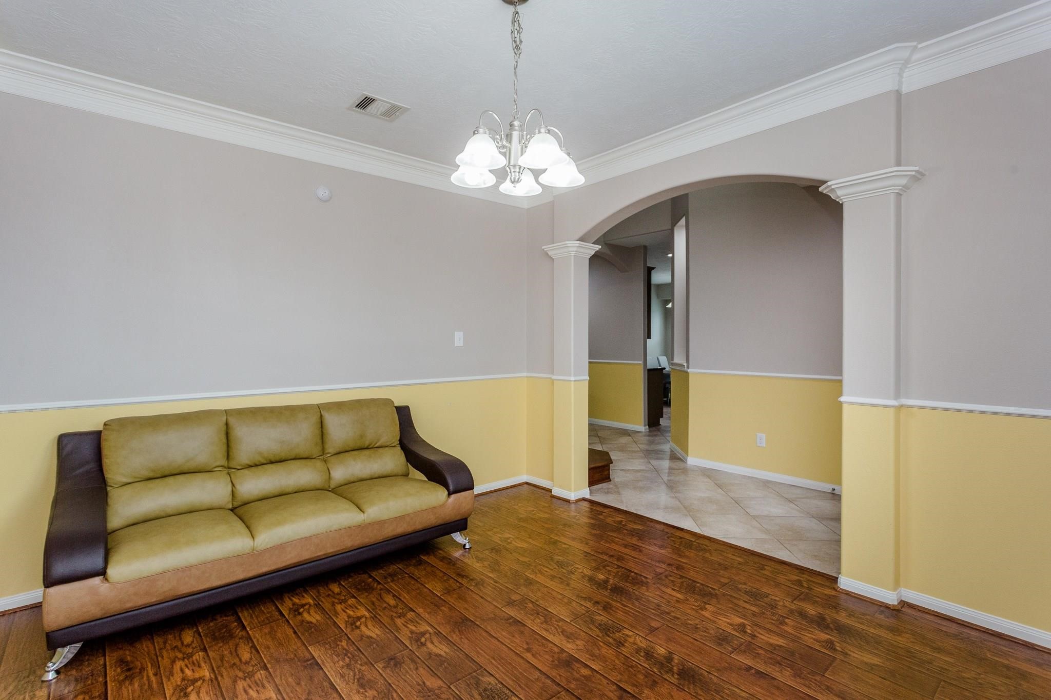 3430 Lilac Ranch Drive Katy, TX 77494 - Photo 5 of 29 a living room with furniture and a chandelier