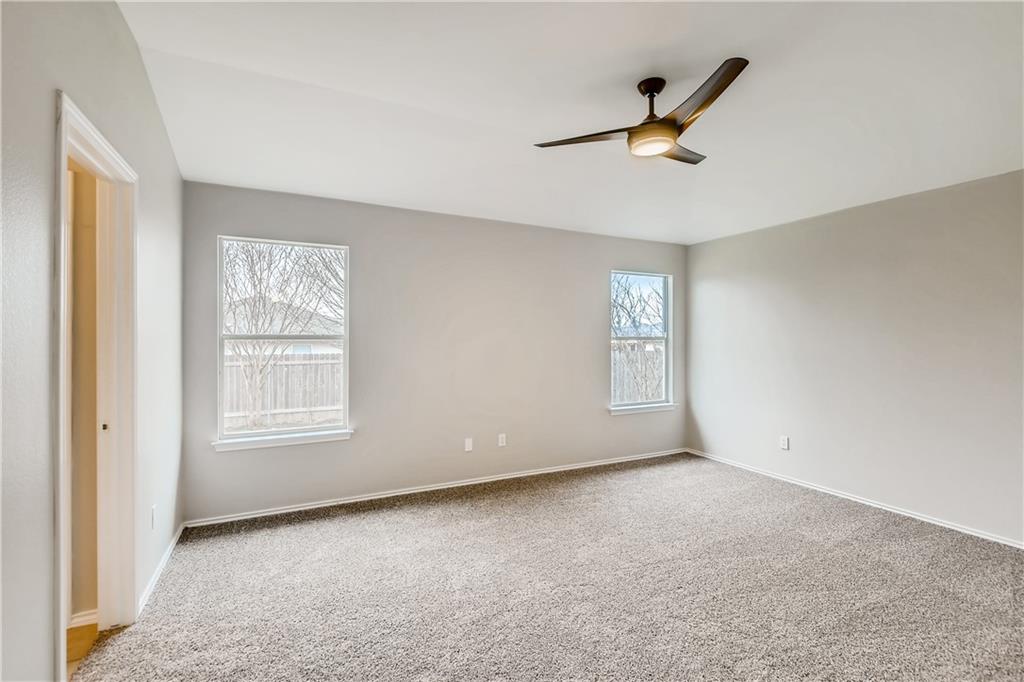 229 Killian Loop Hutto, TX 78634 - Photo 13 of 28 a view of an empty room with a window