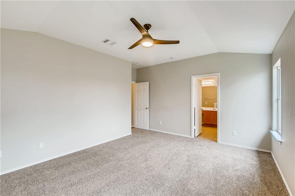 229 Killian Loop Hutto, TX 78634 - Photo 15 of 28 a view of a livingroom with a ceiling fan and wooden floor