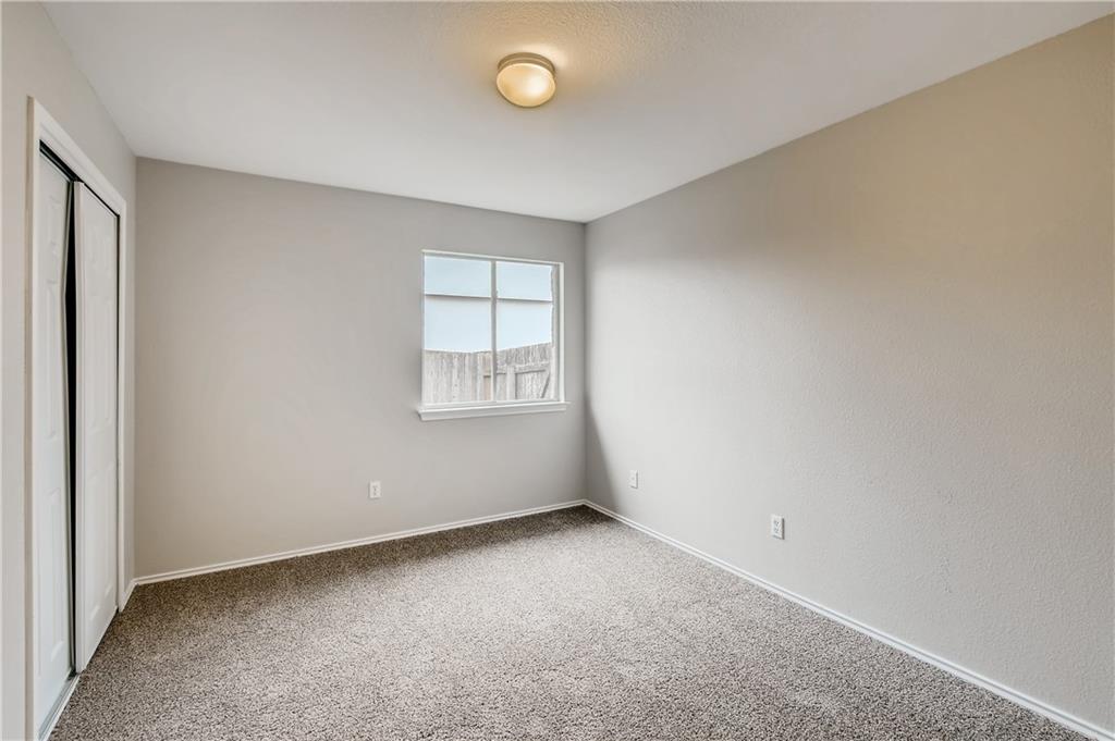 229 Killian Loop Hutto, TX 78634 - Photo 17 of 28 an empty room with windows