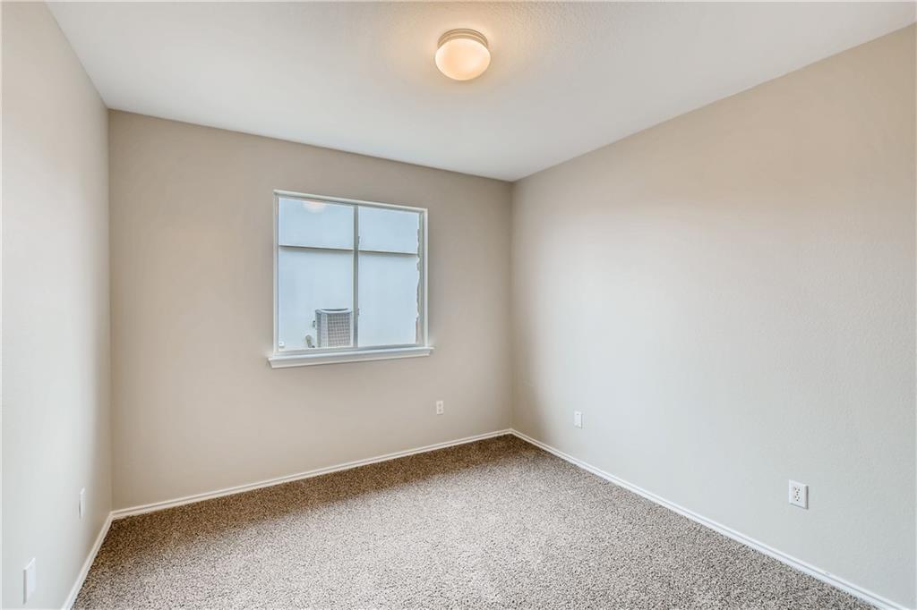 229 Killian Loop Hutto, TX 78634 - Photo 18 of 28 an empty room with a window