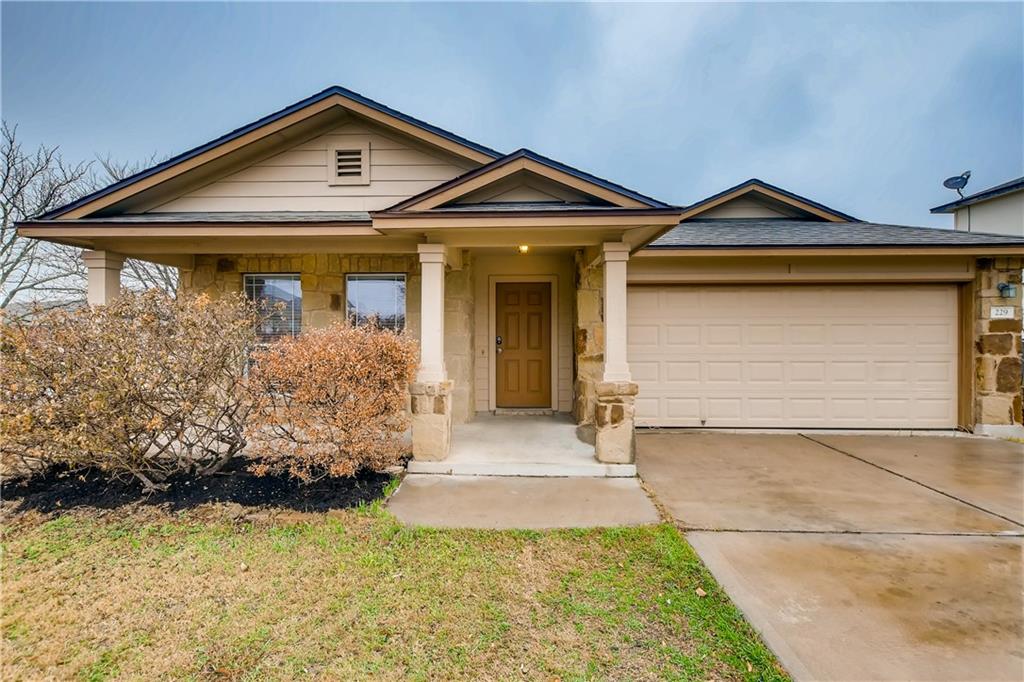 229 Killian Loop Hutto, TX 78634 - Photo 3 of 28 a front view of a house with garden