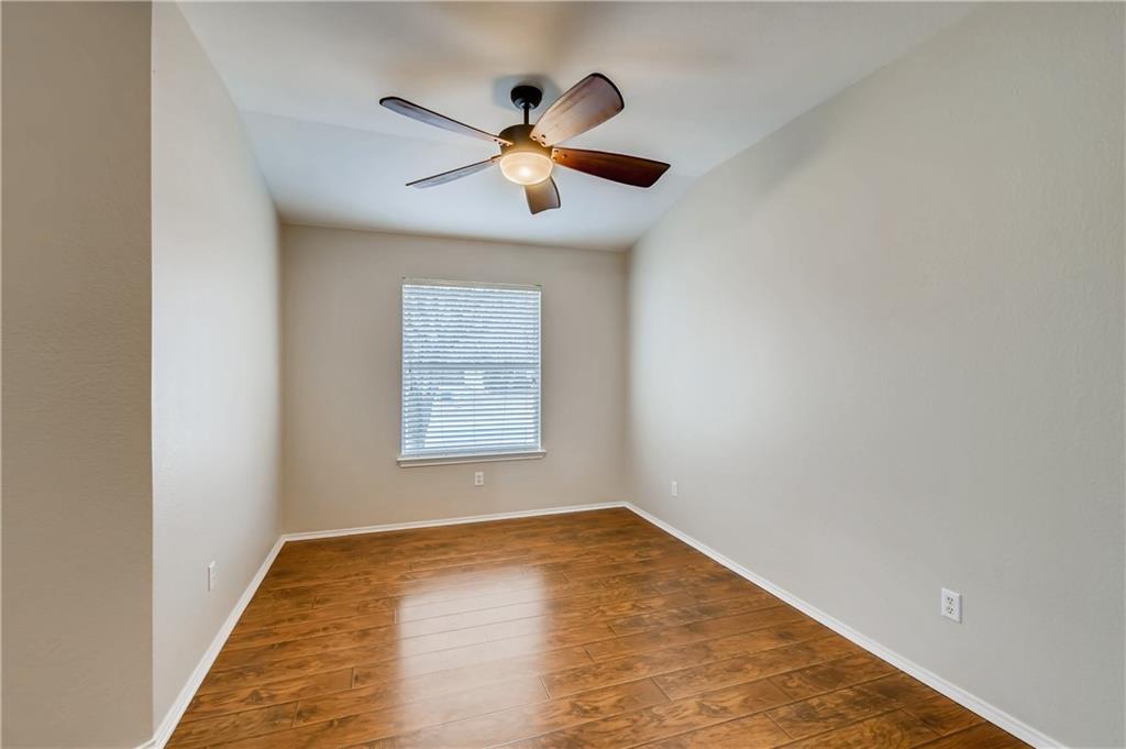 229 Killian Loop Hutto, TX 78634 - Photo 6 of 28 a view of empty room with wooden floor
