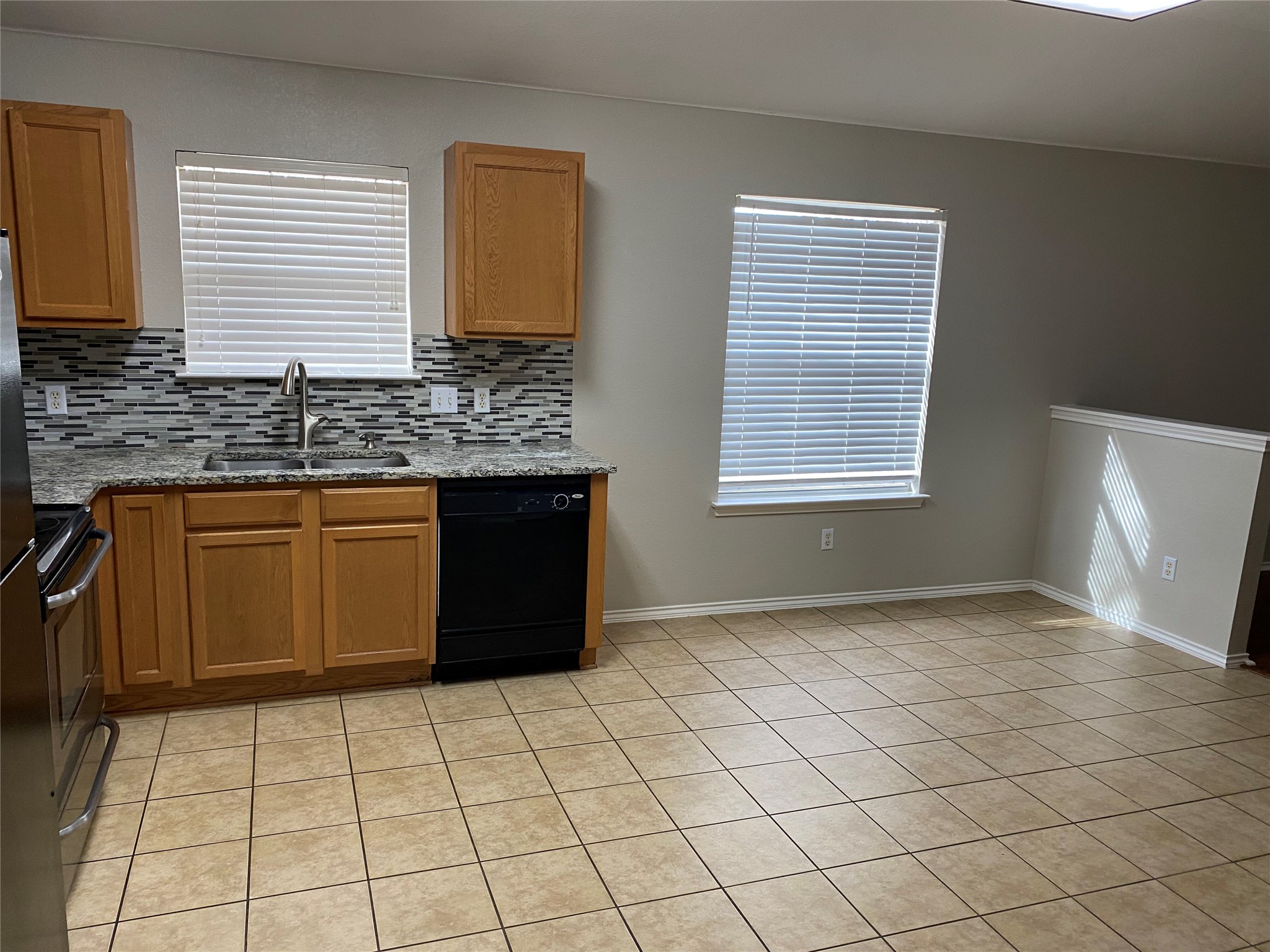 229 Killian Loop Hutto, TX 78634 - Photo 9 of 28 a view of a kitchen that has a sink and a stove top oven
