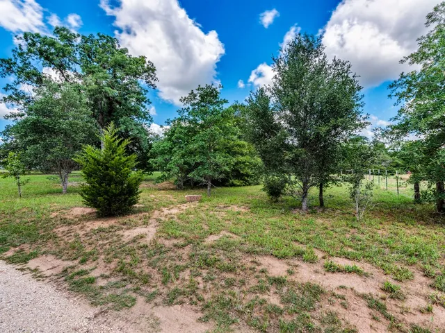 a backyard of a house with lots of green space