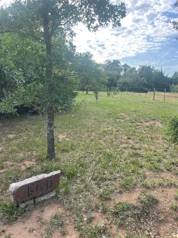 a view of a lake with a yard