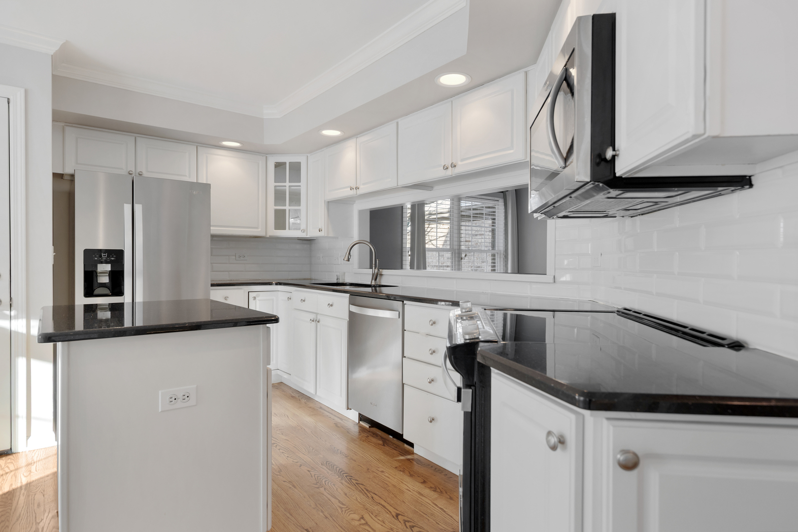 14707 Hollow Tree Road Orland Park, IL 60462 - Photo 15 of 47 a kitchen with stainless steel appliances granite countertop a sink and cabinets