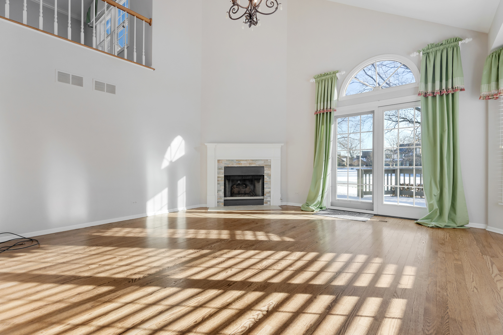 14707 Hollow Tree Road Orland Park, IL 60462 - Photo 6 of 47 a view of an empty room with wooden floor and a window