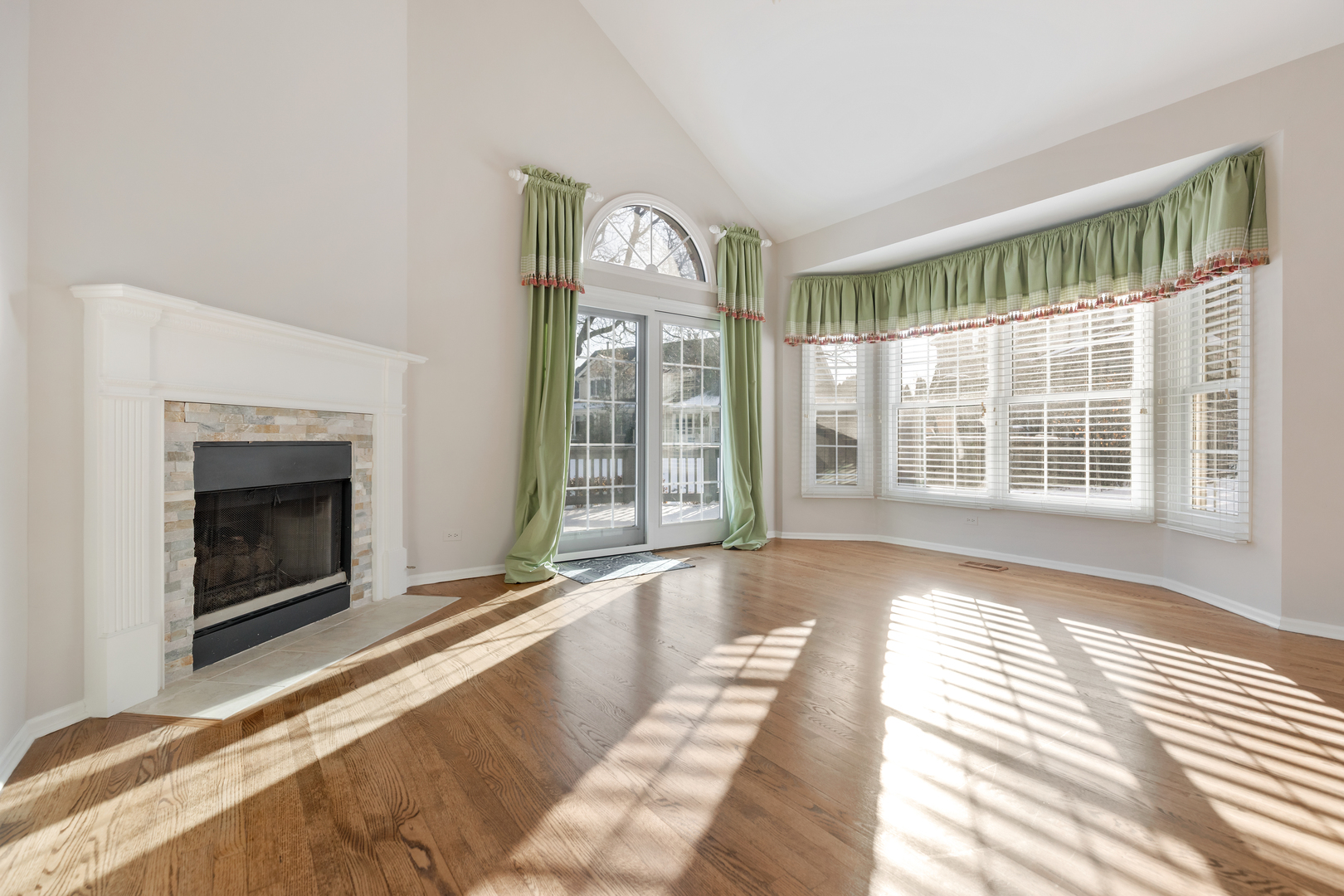 14707 Hollow Tree Road Orland Park, IL 60462 - Photo 8 of 47 a view of an empty room with wooden floor fireplace and windows