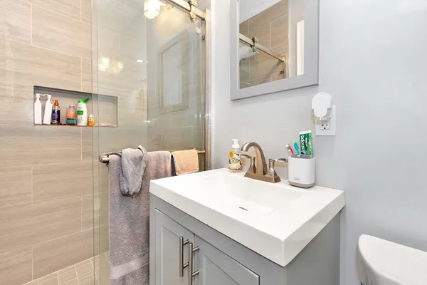 a bathroom with a sink and a mirror