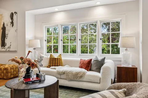 a kitchen with stainless steel appliances kitchen island granite countertop a refrigerator a stove and a sink