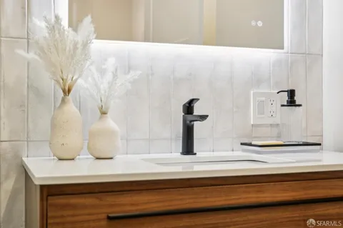 a group of people sitting in front of a building