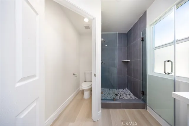 a bathroom with a bathtub and shower