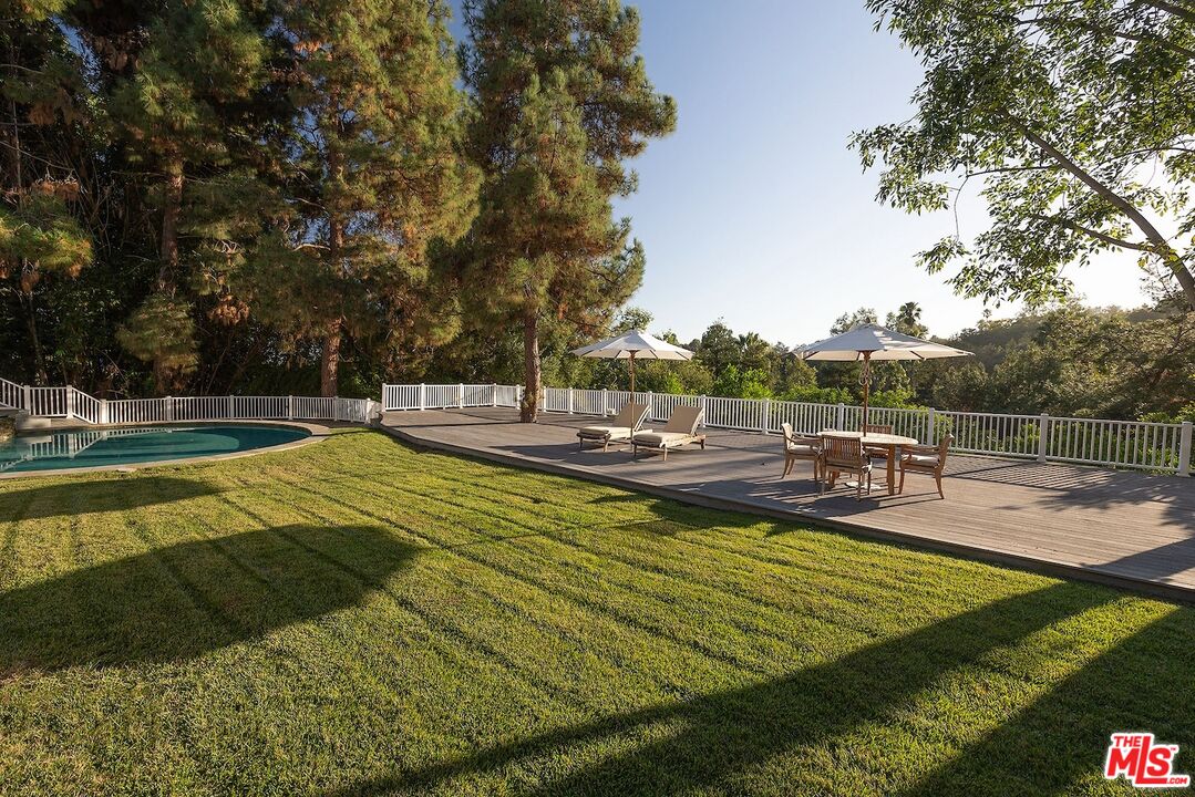 655 North Faring Road Los Angeles, CA 90077 - Photo 19 of 26 a view of a swimming pool with a patio