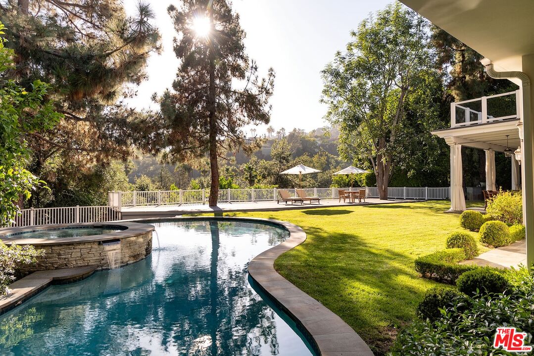 655 North Faring Road Los Angeles, CA 90077 - Photo 25 of 26 a view of a swimming pool with an outdoor seating