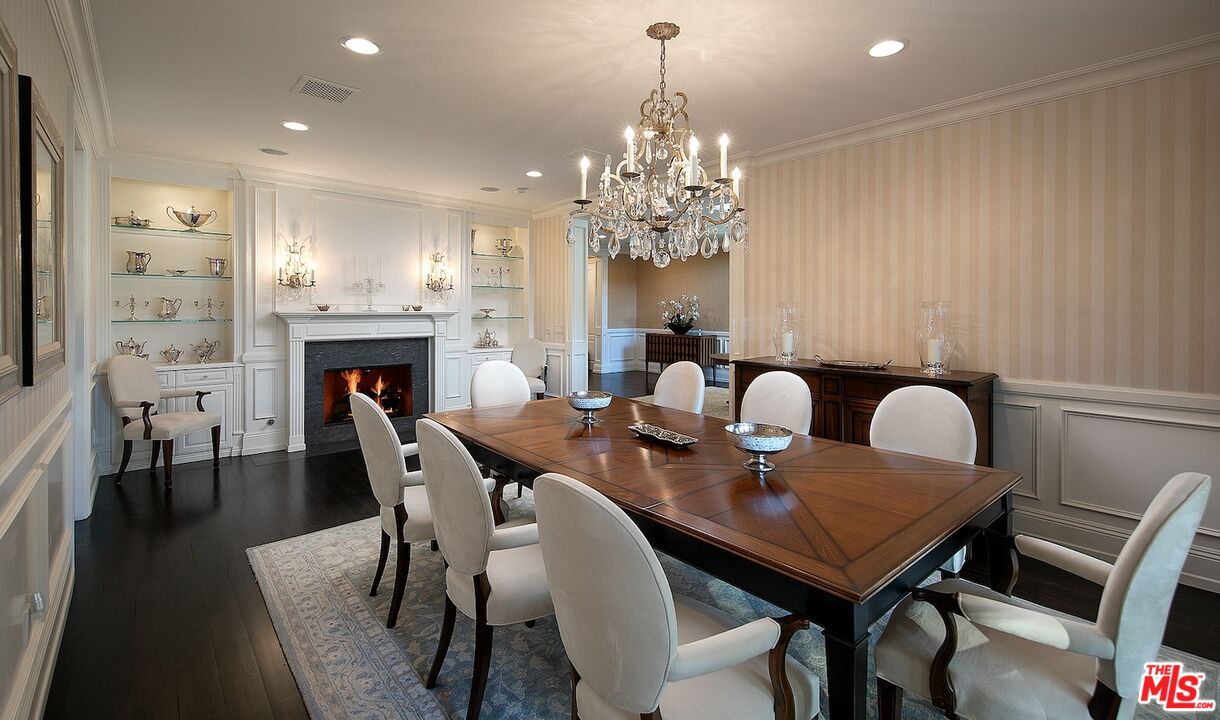 655 North Faring Road Los Angeles, CA 90077 - Photo 10 of 26 a view of a dining room with furniture and chandelier