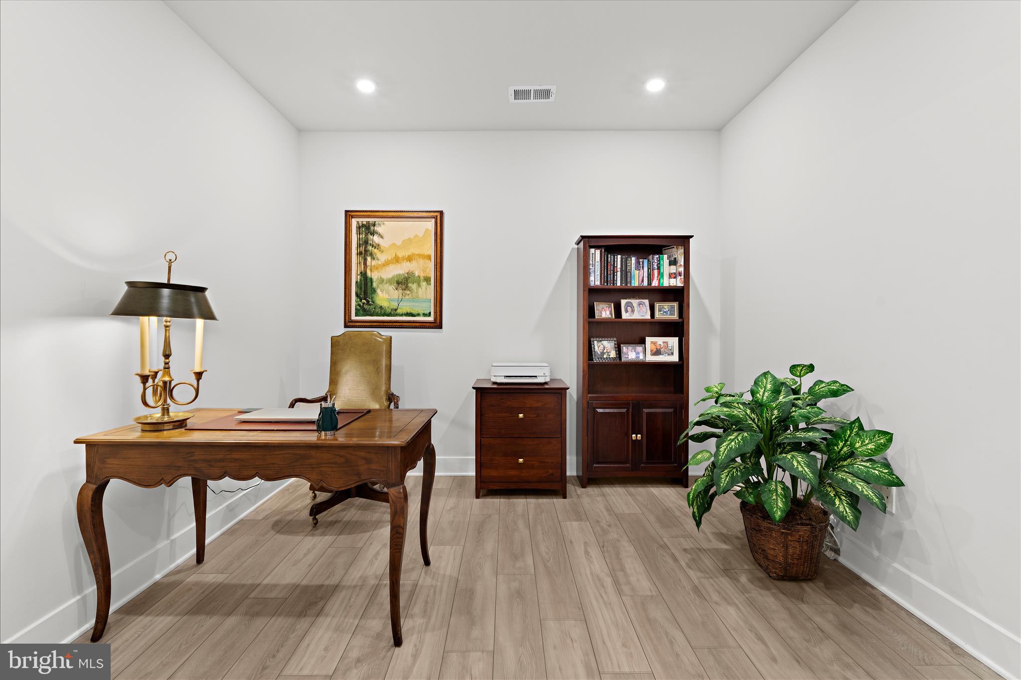 132 Wheelhouse Way, Unit 11 Chester, MD 21619 - Photo 10 of 77 a view of a workspace with furniture and wooden floor