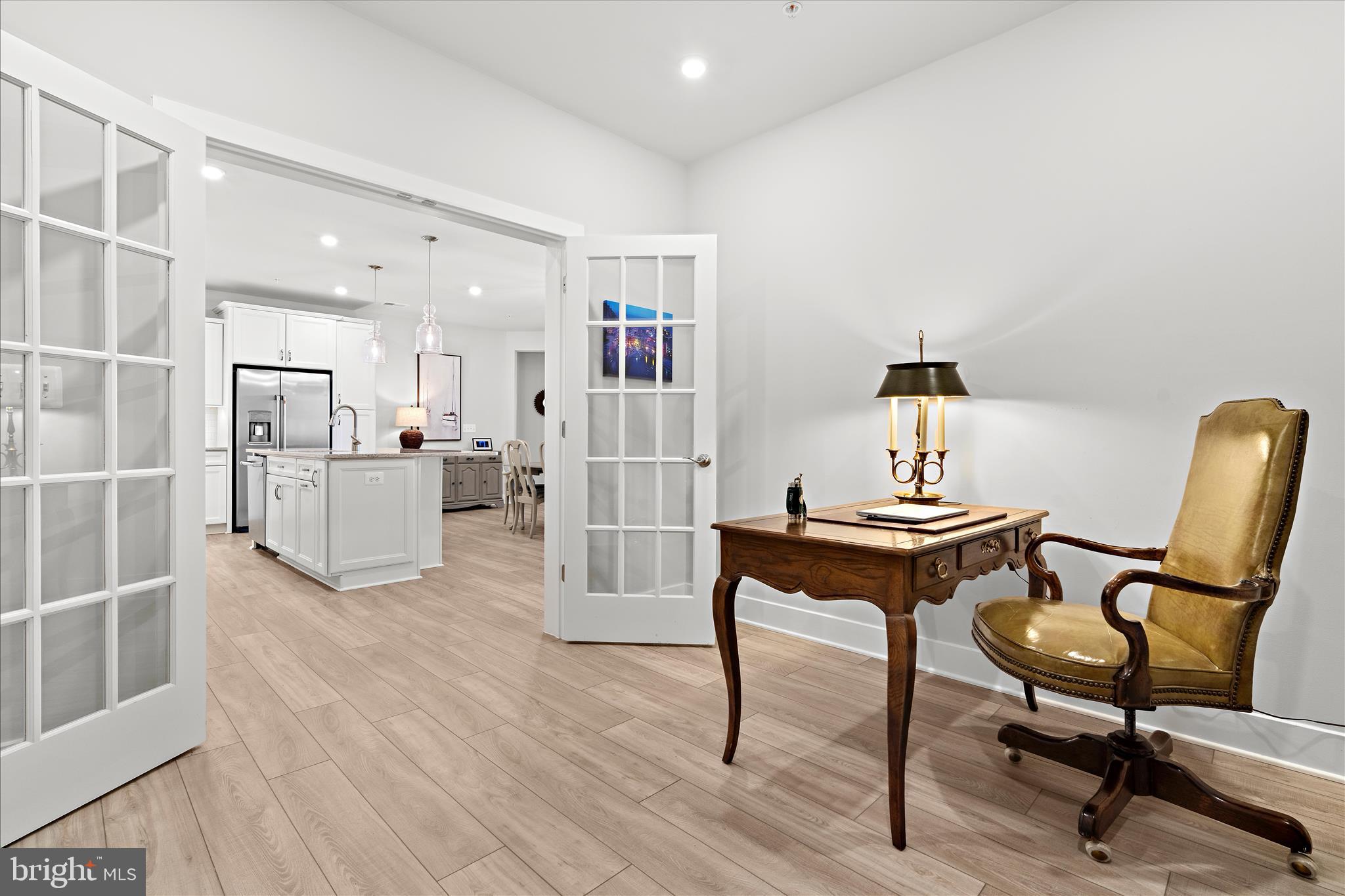 132 Wheelhouse Way, Unit 11 Chester, MD 21619 - Photo 11 of 77 a view of a workspace with furniture and a window