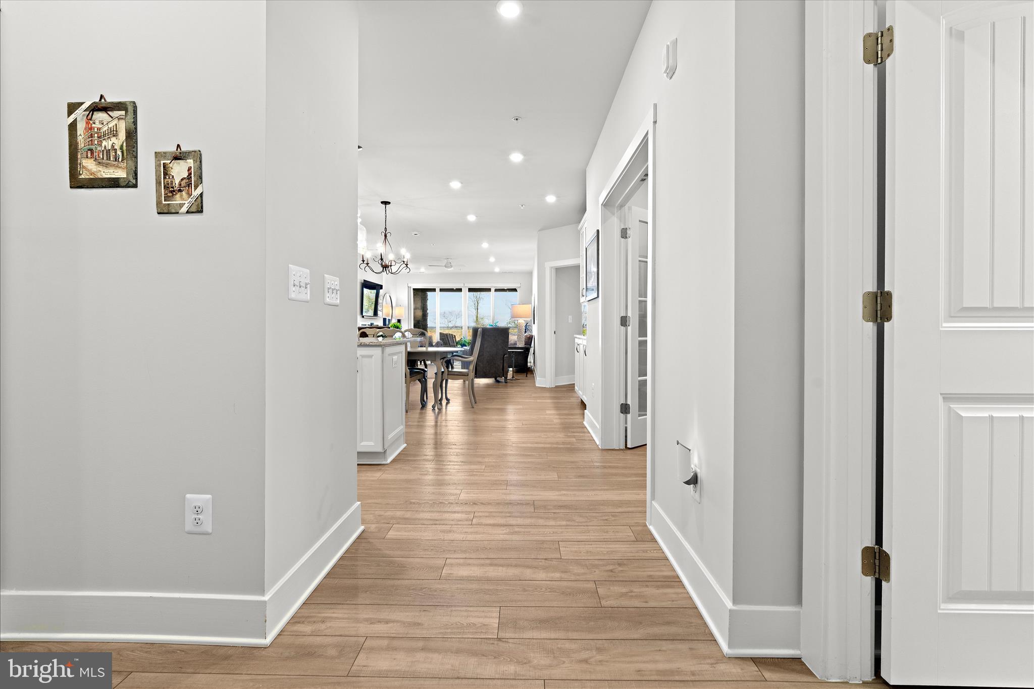 132 Wheelhouse Way, Unit 11 Chester, MD 21619 - Photo 12 of 77 a view of a hallway with wooden floor