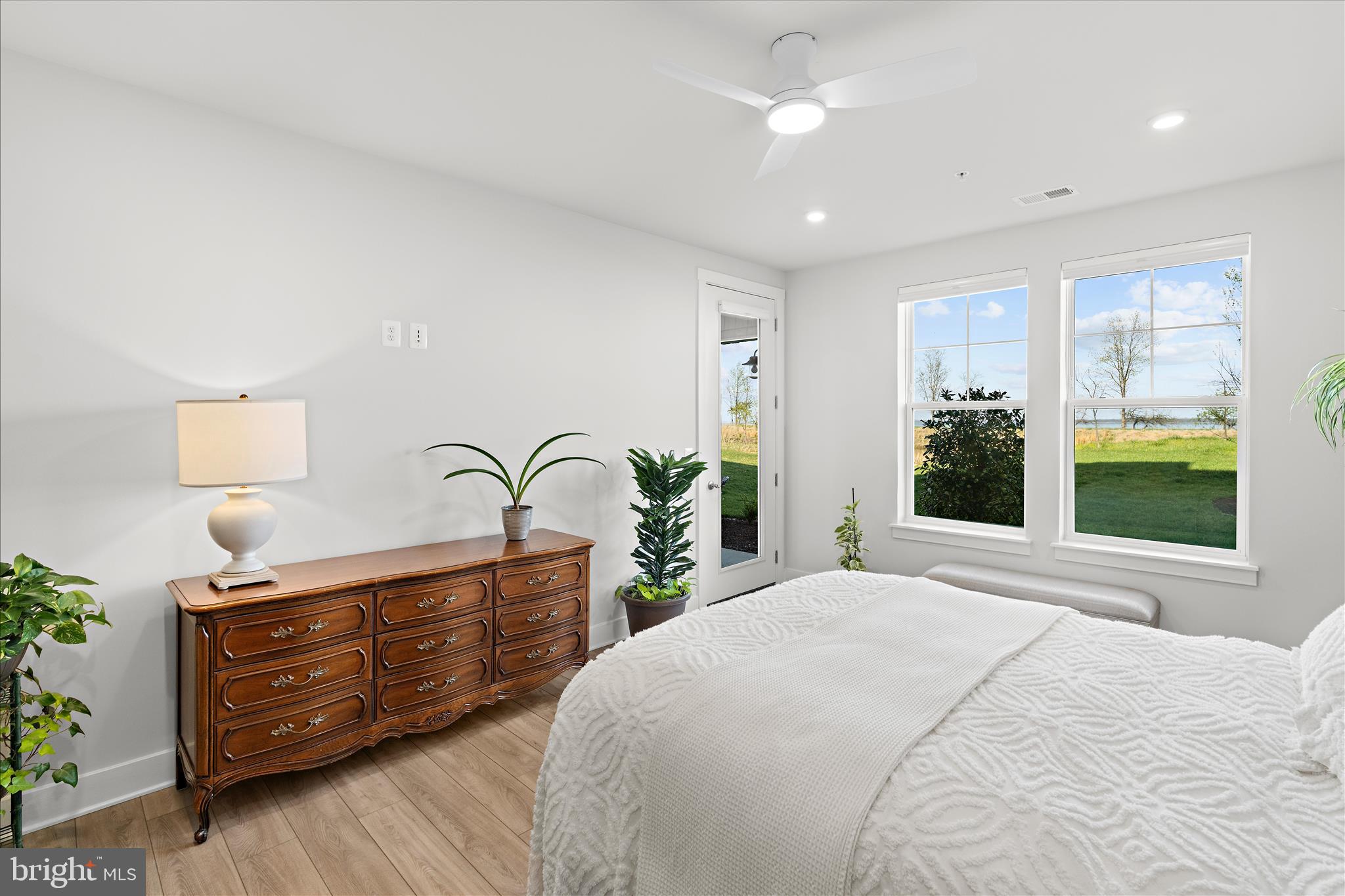 132 Wheelhouse Way, Unit 11 Chester, MD 21619 - Photo 15 of 77 a bedroom with a bed and a dresser