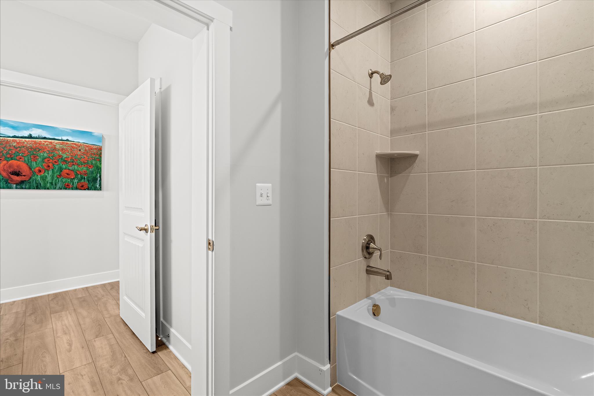 132 Wheelhouse Way, Unit 11 Chester, MD 21619 - Photo 24 of 77 a bathroom with a bathtub and a shower