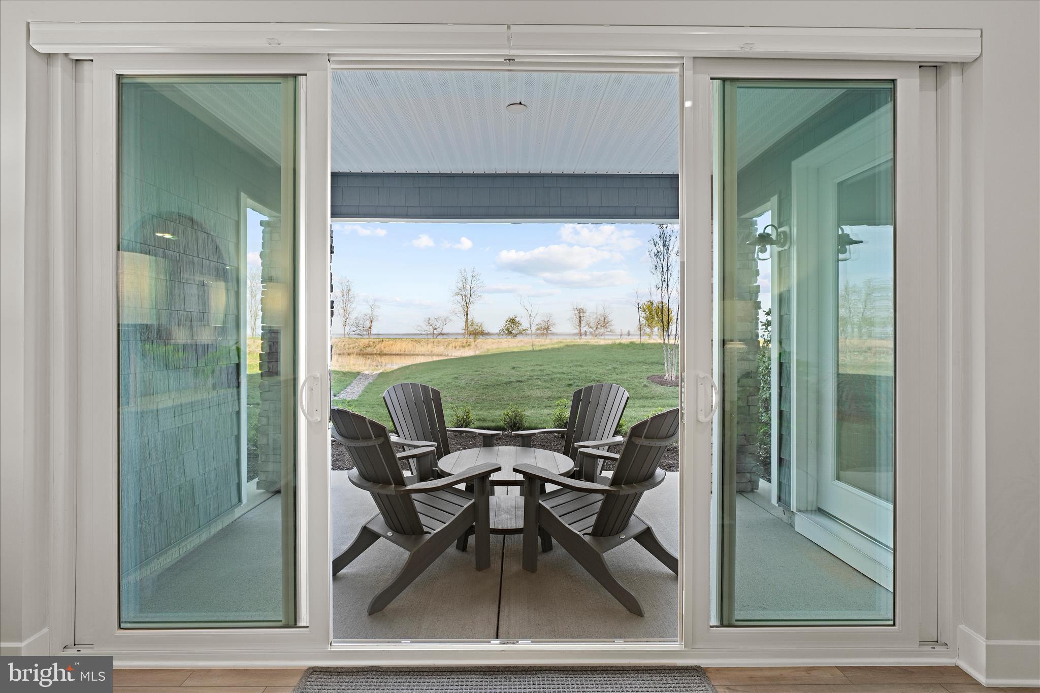 132 Wheelhouse Way, Unit 11 Chester, MD 21619 - Photo 26 of 77 a view of a room that has a bed and a table in it