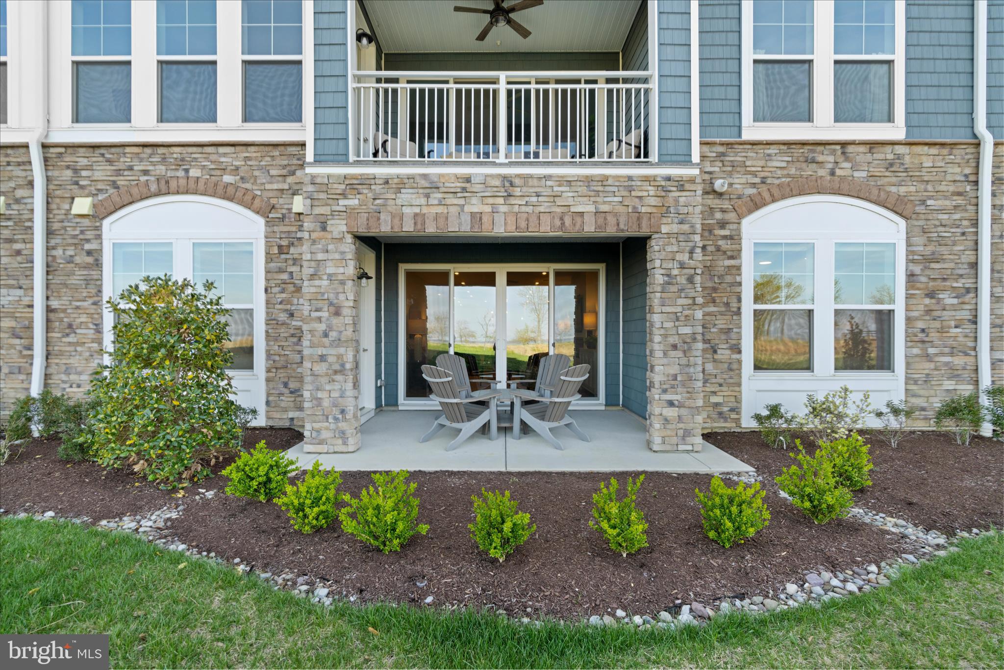 132 Wheelhouse Way, Unit 11 Chester, MD 21619 - Photo 30 of 77 a front view of a house with garden