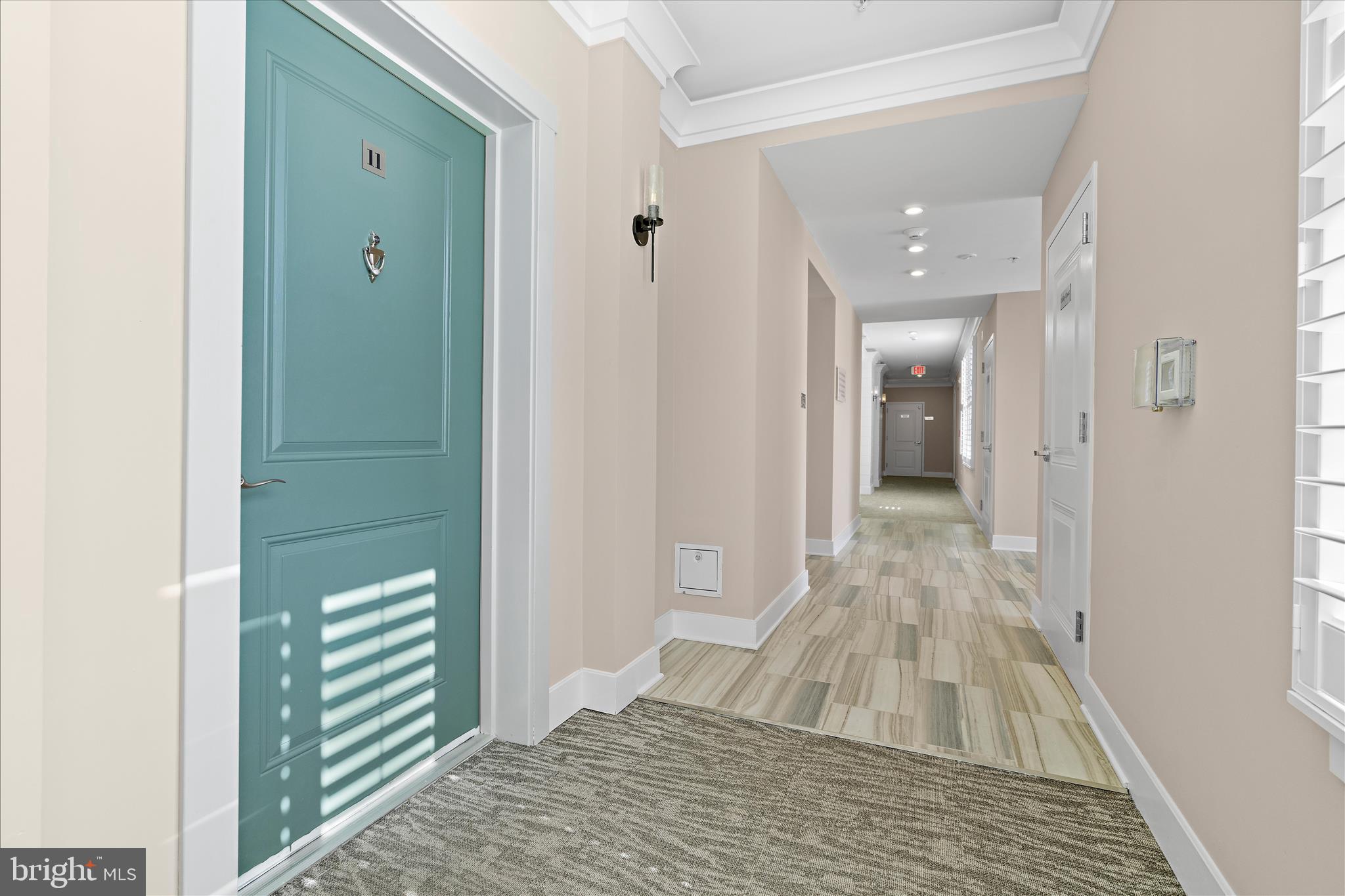 132 Wheelhouse Way, Unit 11 Chester, MD 21619 - Photo 33 of 77 a bathroom with a sink and a mirror