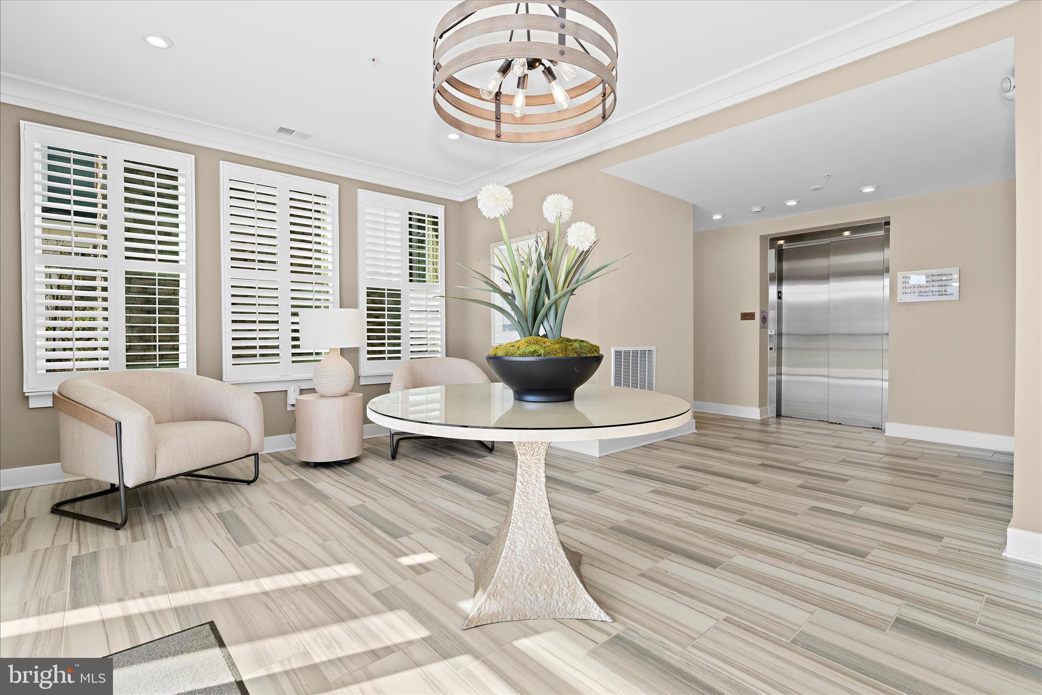 132 Wheelhouse Way, Unit 11 Chester, MD 21619 - Photo 35 of 77 a living room with furniture and a large window