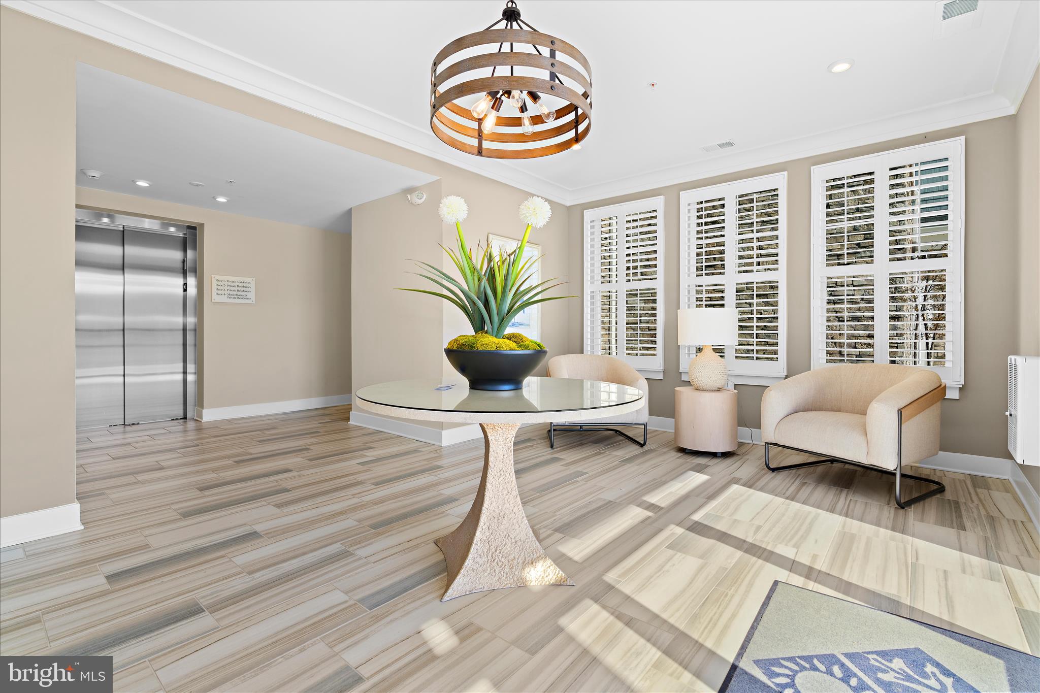 132 Wheelhouse Way, Unit 11 Chester, MD 21619 - Photo 36 of 77 a living room with furniture and a potted plant