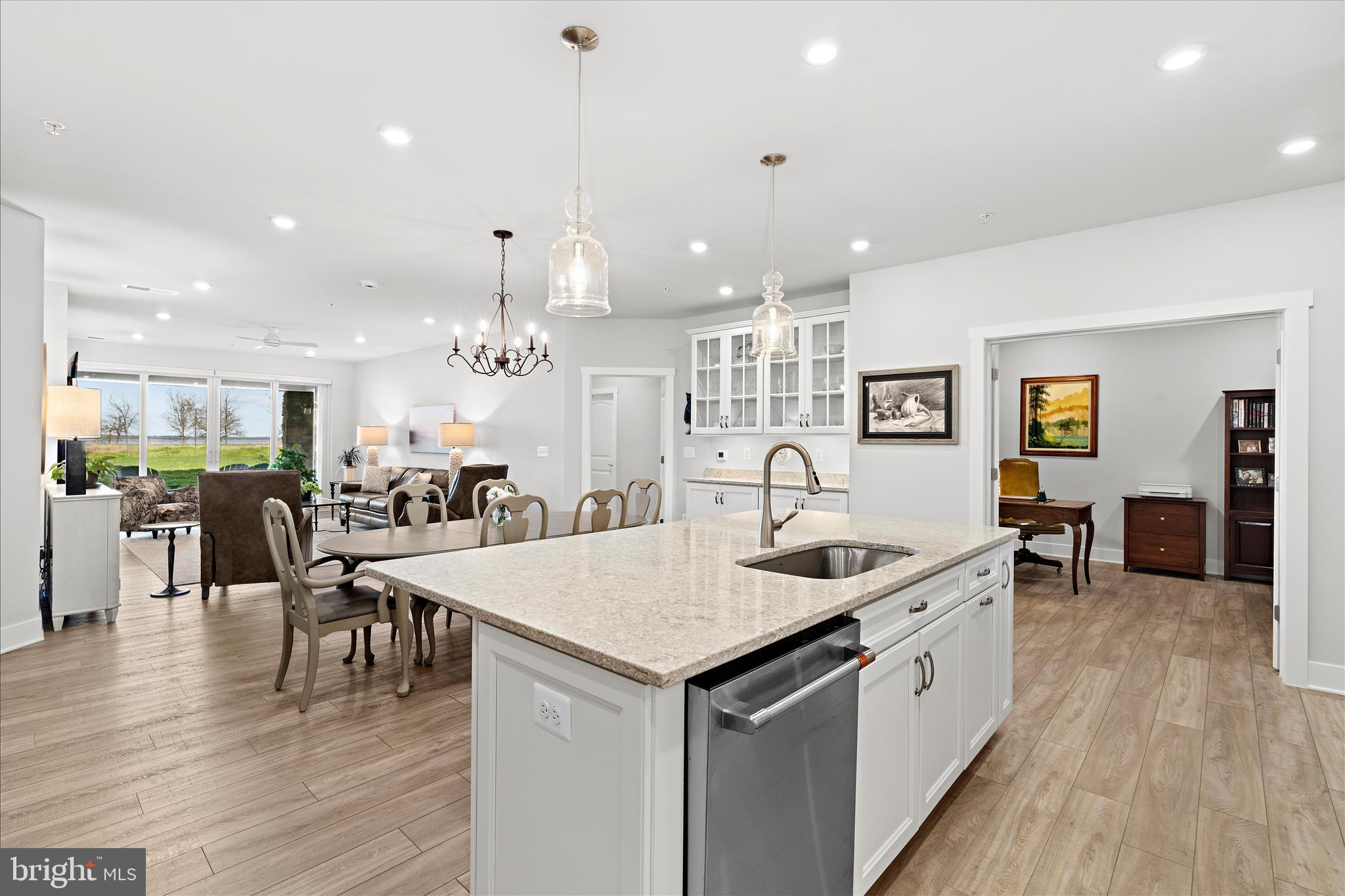 132 Wheelhouse Way, Unit 11 Chester, MD 21619 - Photo 77 of 77 a open kitchen with stainless steel appliances granite countertop a kitchen island a stove and a sink
