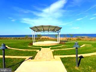 132 Wheelhouse Way, Unit 11 Chester, MD 21619 - Photo 59 of 77 a view of a swimming pool with an outdoor space and seating area