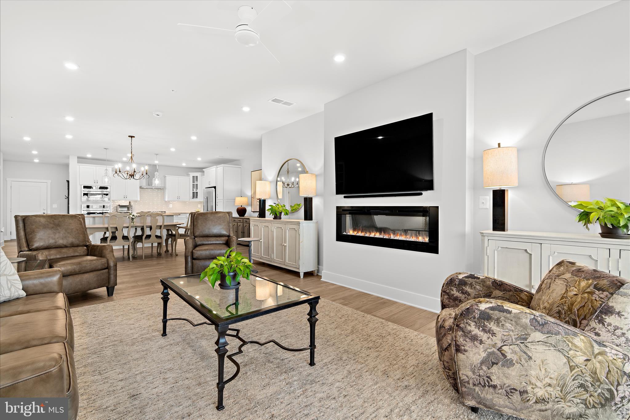 132 Wheelhouse Way, Unit 11 Chester, MD 21619 - Photo 7 of 77 a living room with furniture and a flat screen tv