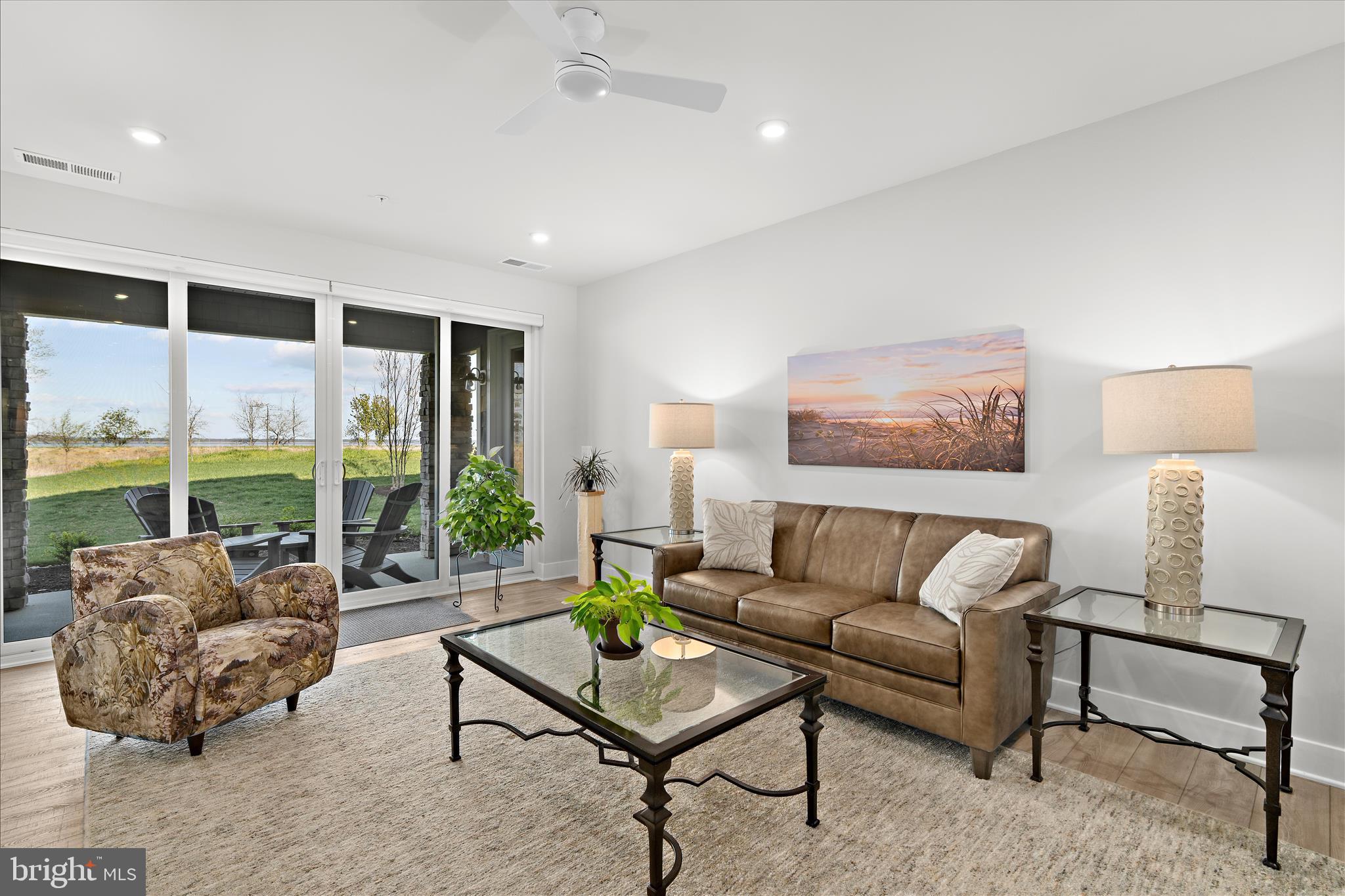 132 Wheelhouse Way, Unit 11 Chester, MD 21619 - Photo 9 of 77 a living room with furniture and a large window