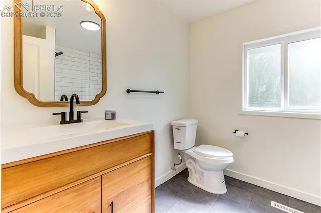 a bathroom with a sink and a toilet