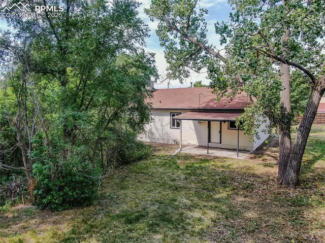a house with trees in front of it