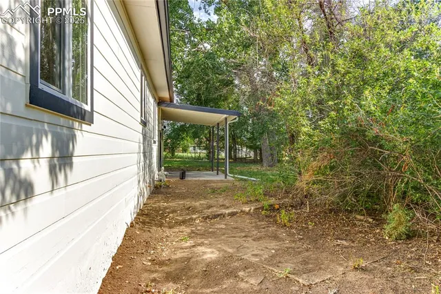a view of a backyard with garden