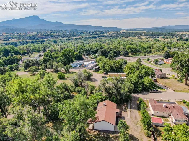 an aerial view of a house with a garden