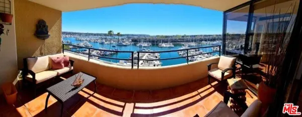 a living room with a couch and a mirror