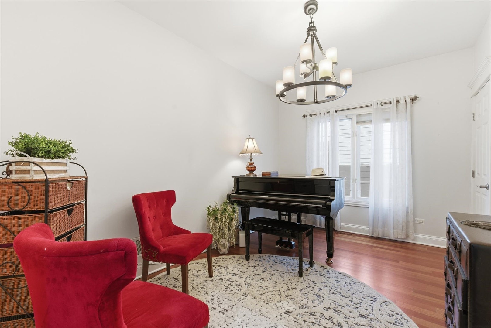 395 Scott Street Elmhurst, IL 60126 - Photo 12 of 46 a view of a dining room with furniture wooden floor and chandelier