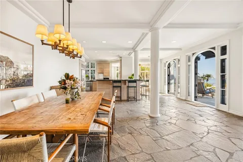 a very nice looking dining room with a table and chairs