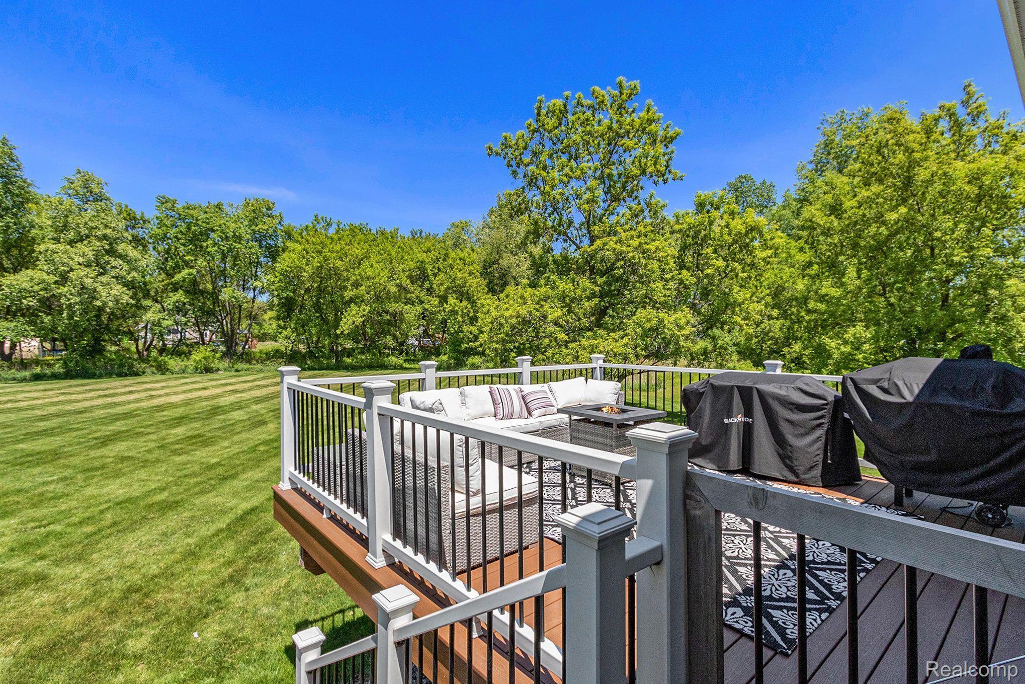 TREX DECK HAS GATE & STAIRS TO THE YARD