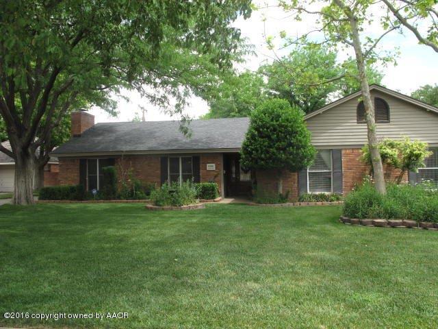 6306 Jameson Road Amarillo, TX 79106 - Photo 2 of 32 a front view of a house with a yard and trees